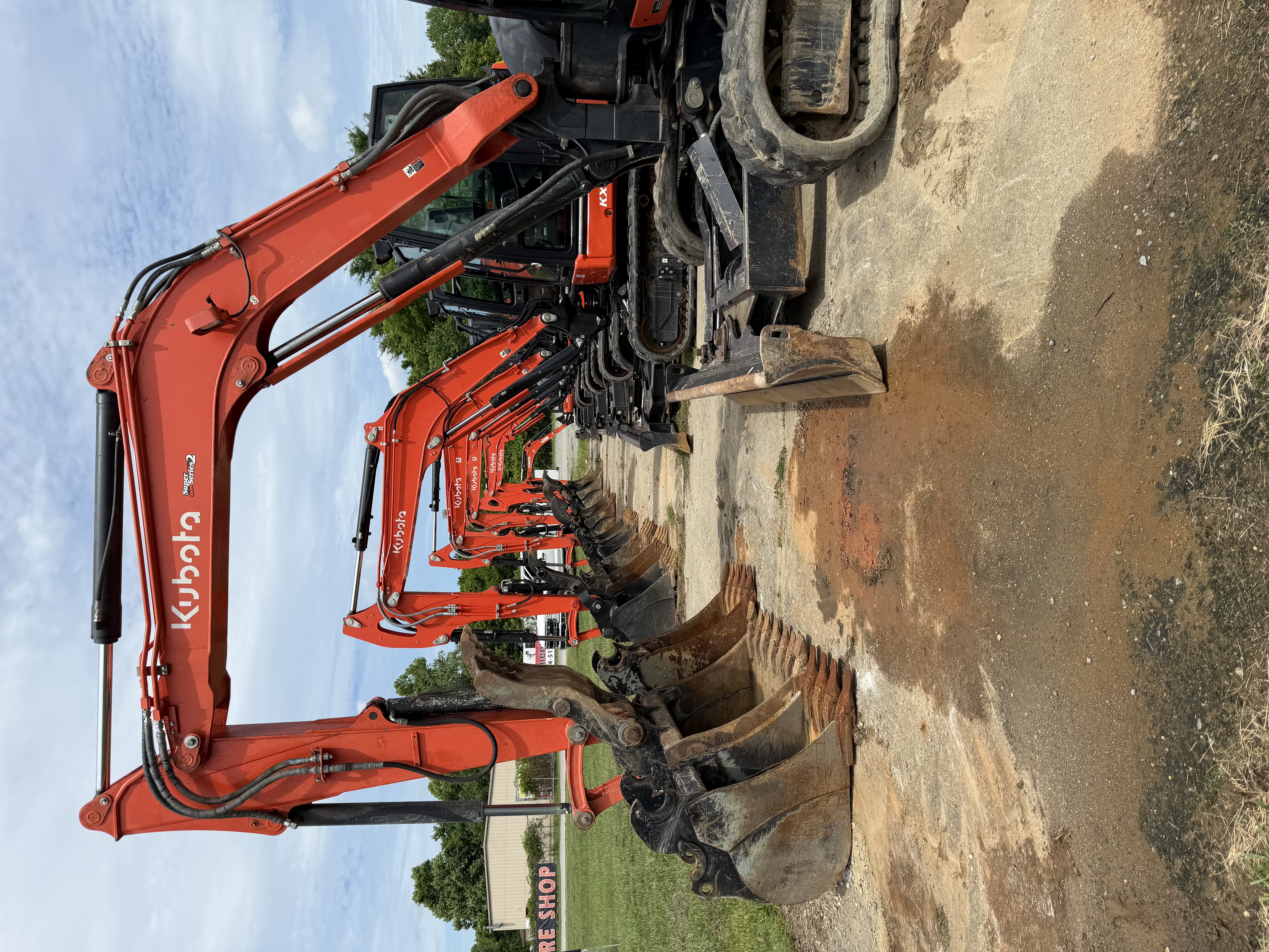 Row of Kubota KX excavators lined up and ready to rent at 58 Equipment Rentals in Halifax County, Virginia